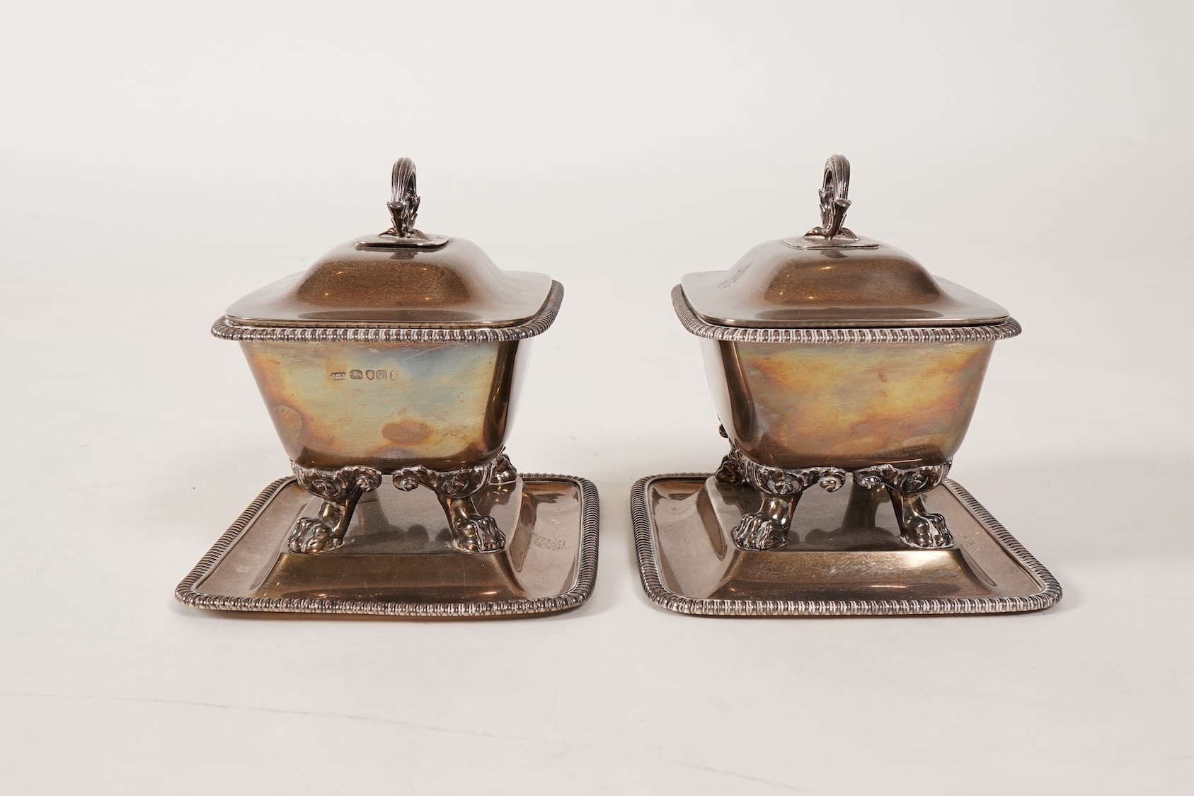 A pair of George IV silver sauce tureens with covers and integral stands, by Philip Rundell